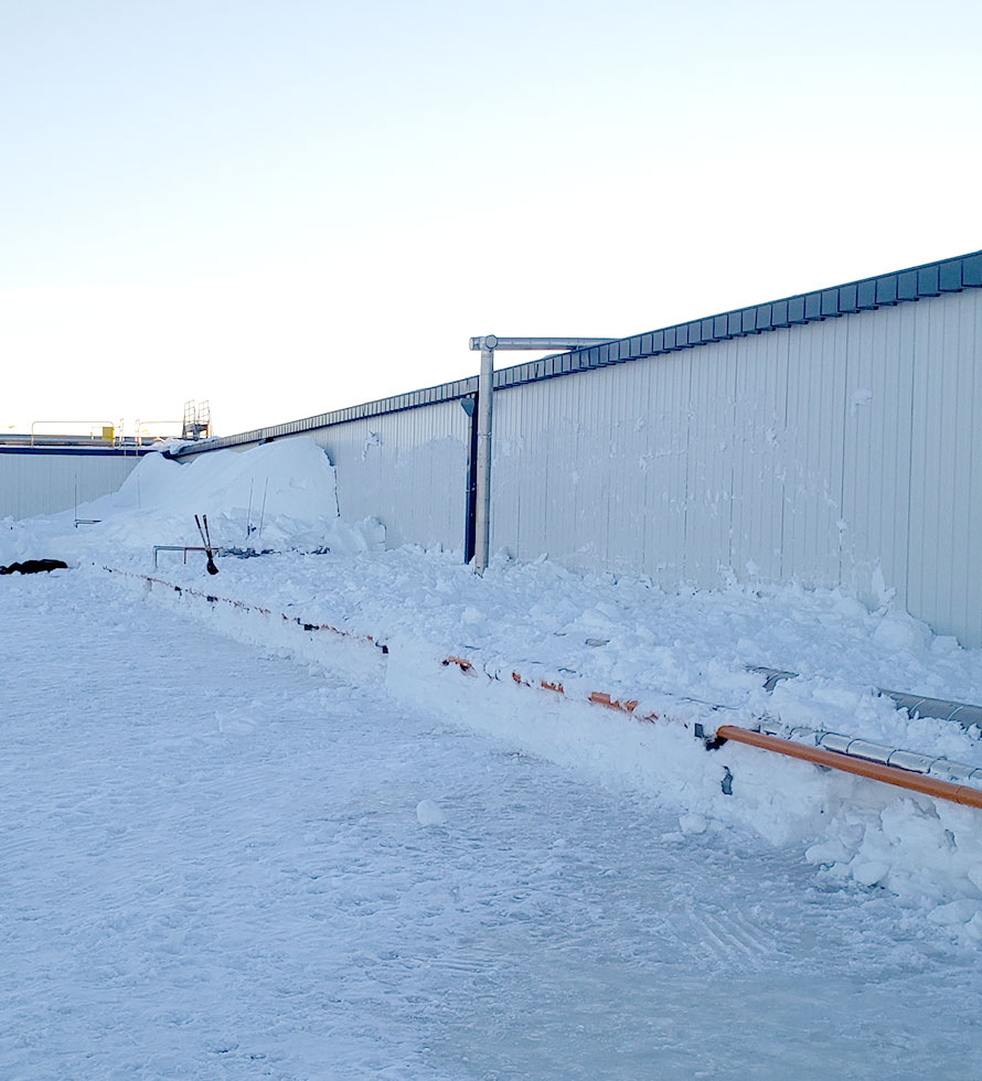warehouse roof under snow 