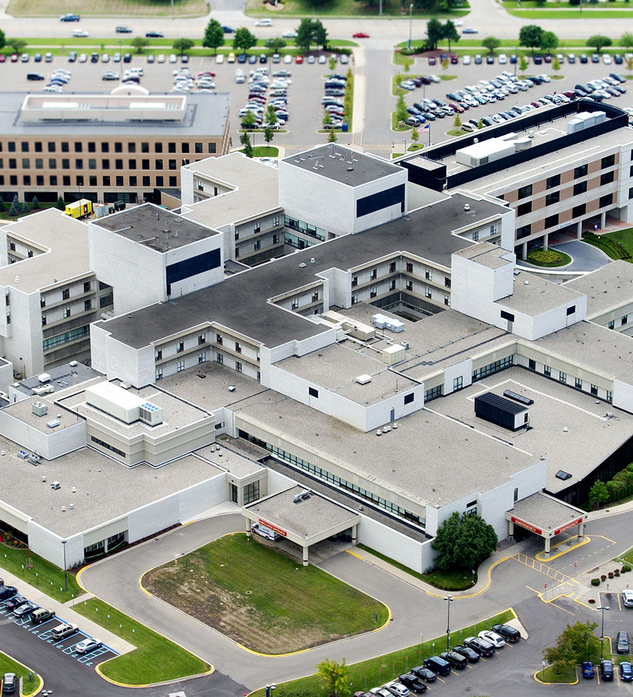 drone picture of a large hospital sowing the roof projections like HVAC units