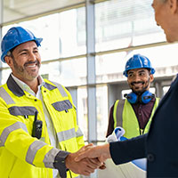 Service Sales Representative shaking hands with a client