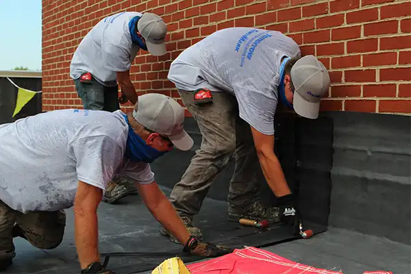 CentiMark’s roofing crew working on a flat EPDM roof